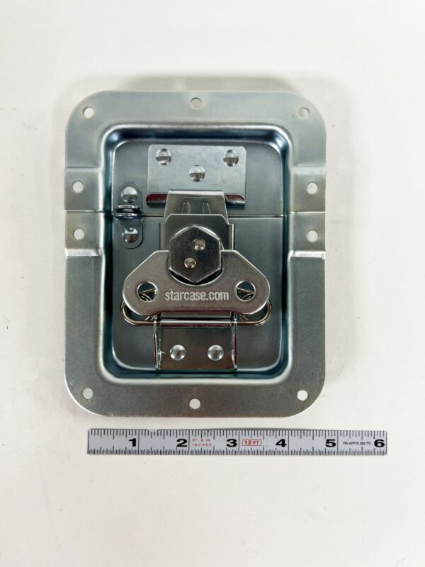 A metal box with a ruler and a meter