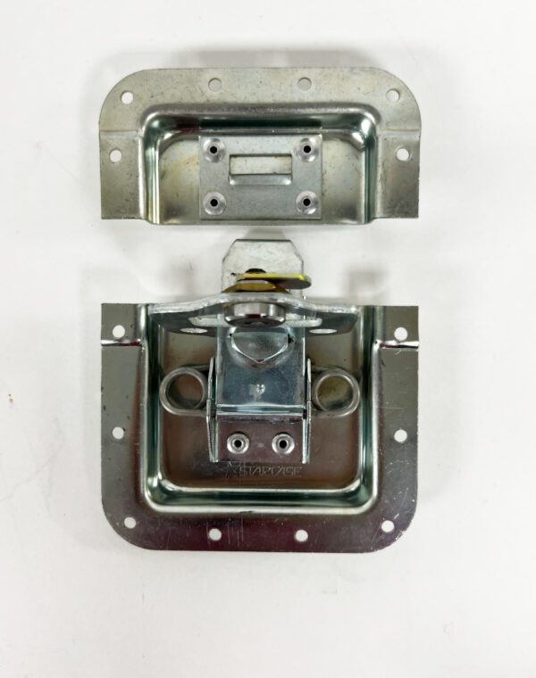 A metal open face latch with two locks.