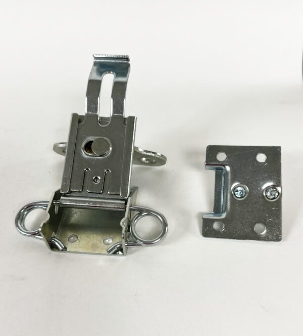A metal door latch and a plate with two locks.