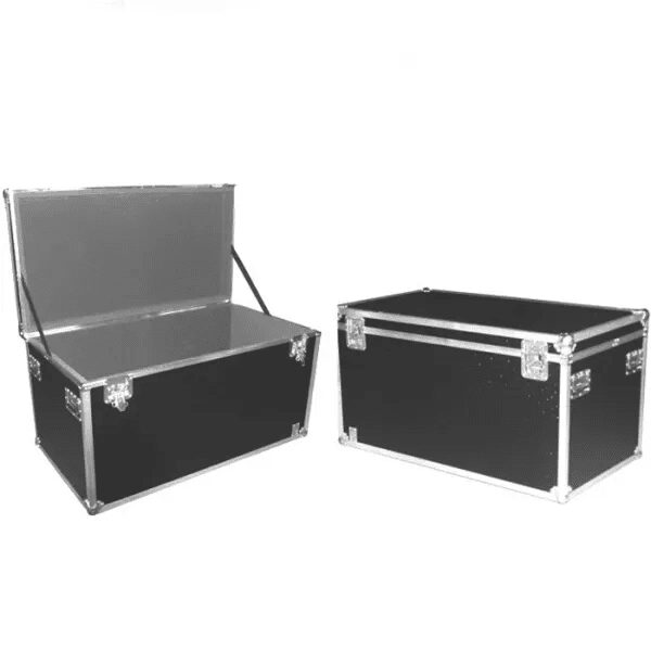 A black trunk and seat are next to each other.