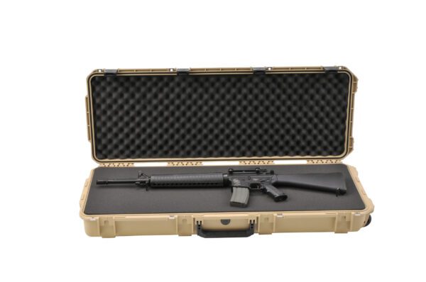 A rifle in an open case with the lid closed.