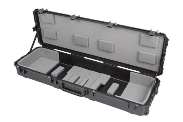 A black case with many compartments and two trays.