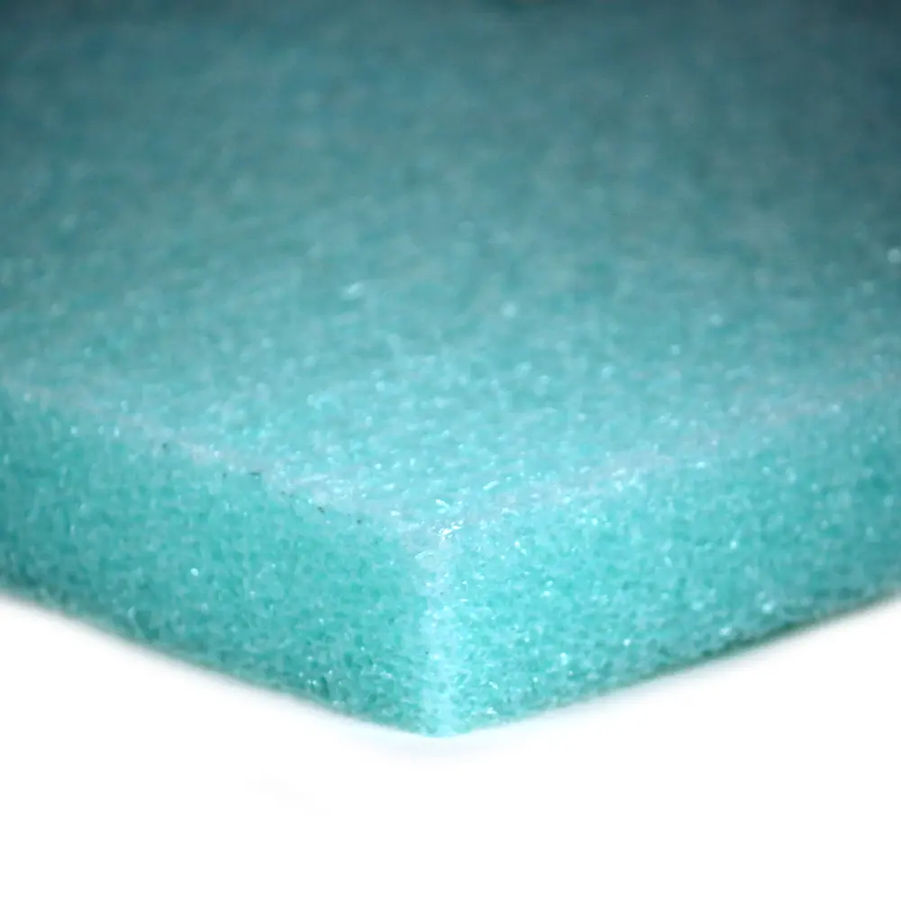 A close up of the edge of a green foam pad.
