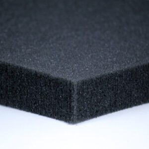 A close up of the edge of a black foam pad