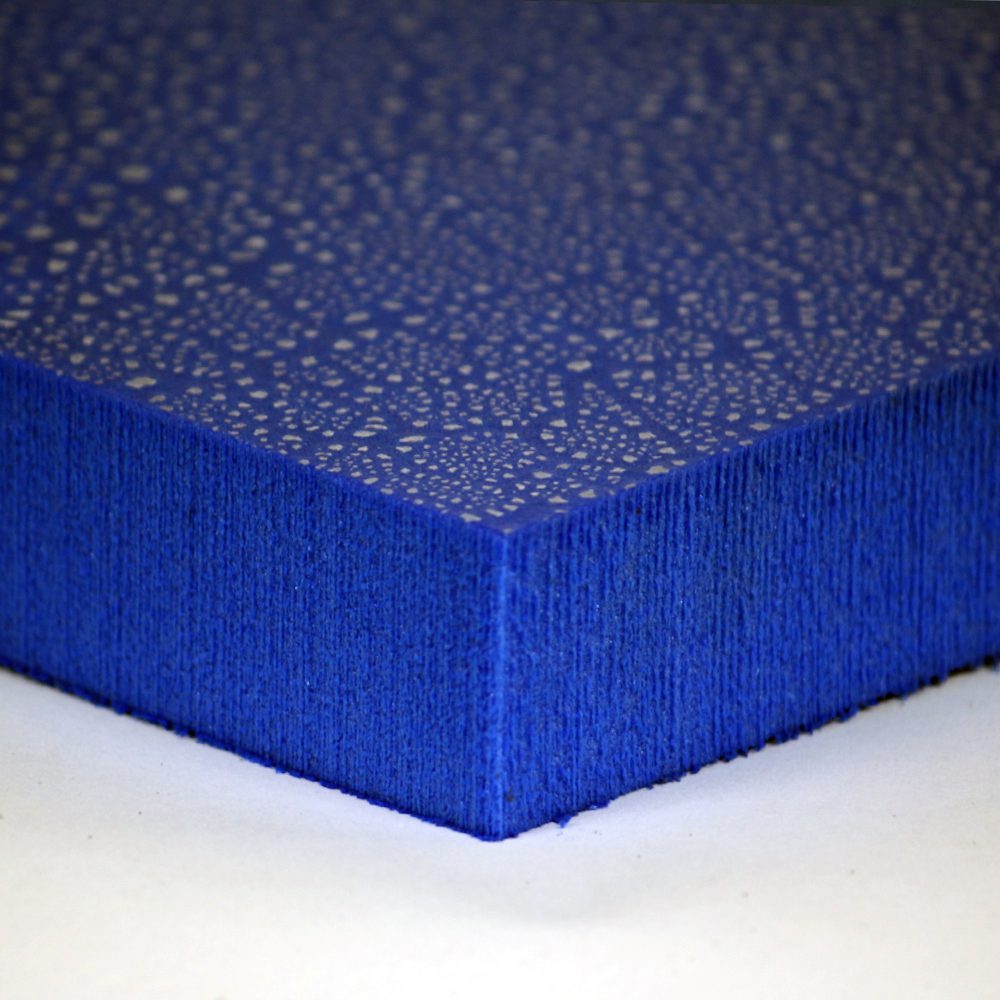 A close up of the corner of a blue foam block.