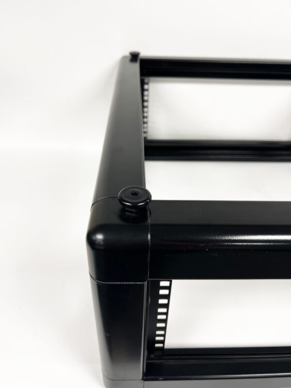 A black frame with a metal bar on top of it.