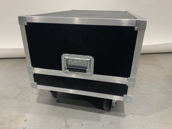 A black and silver box with wheels on the floor
