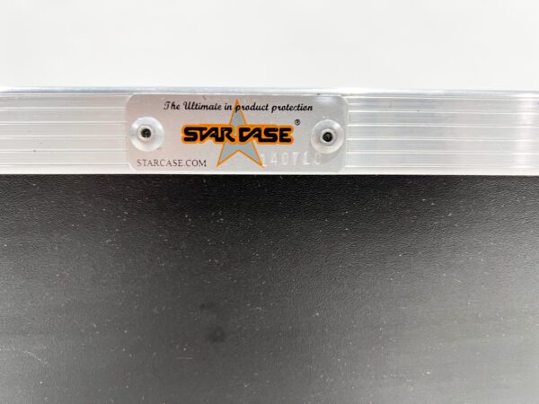 A close up of the star pase logo on a metal surface.