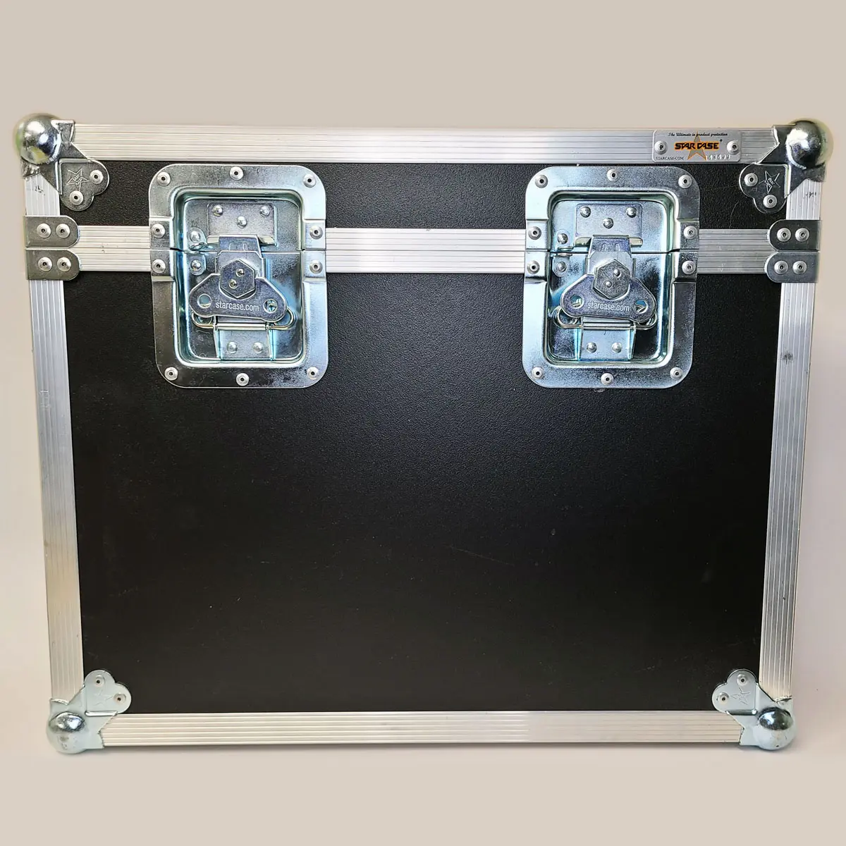 A black plastic road case with silver hardware